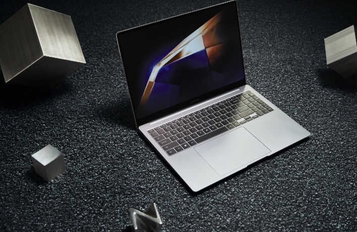 Laptop on textured dark surface